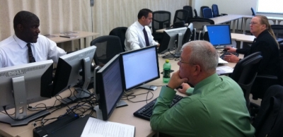 FLETA Assessors reviewing an agency's files.