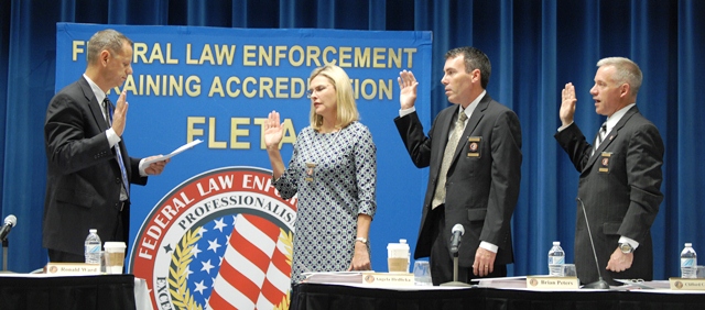 Ron Ward, current FLETA Board Chair administers the Oath of Office to Angela Hrdlicka, Brian Peters, and Cliff Holly.