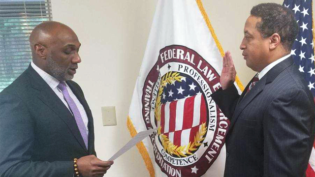 FLETA Board Chair Domenic McClinton administers the Oath of Office to Michael Robinson