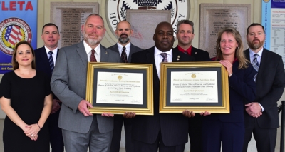 ATF staff holding the FLETA accreditation certificate ATF staff holding the FLETA accreditation certificate