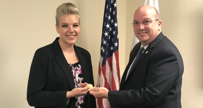 Amber George receiving the FLETA coin from Executive Director Joseph Collins Amber George receiving the FLETA coin from Executive Director Joseph Collins