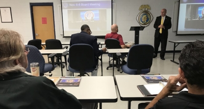 Executive Director Joe Collins speaking with agency personnel stationed in Artesia, NM