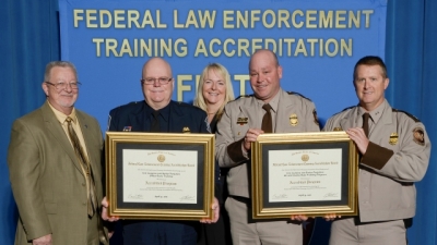 Customs and Border Protection staff present their reaccreditation certificate for Officer Basic Training and Air and Marine Basic Customs and Border Protection staff present their reaccreditation certificate for Officer Basic Training and Air and Marine Basic