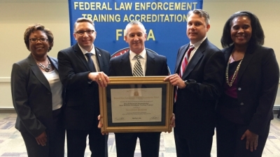 Members from the Drug Enforcement Administration receive their certificate for initial Program Accreditation Members from the Drug Enforcement Administration receive their certificate for initial Program Accreditation