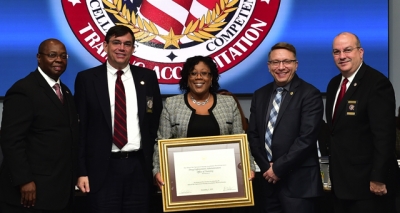 DEA Academy staff holding the FLETA accreditation certificate DEA Academy staff holding the FLETA accreditation certificate