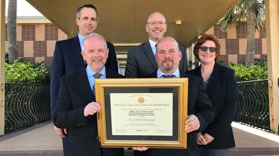 TSA FAMS employees with their certificate of accreditation