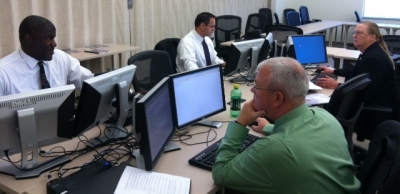 FLETA Assessors reviewing an agency's files. FLETA Assessors reviewing an agency's files.