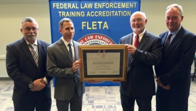 Members from the Federal Law Enforcement Training Centers receive Program Reaccreditation Members from the Federal Law Enforcement Training Centers receive Program Reaccreditation