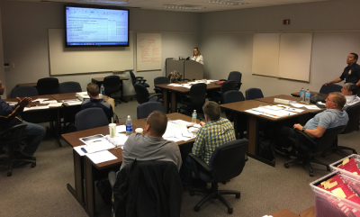Program Manager Jennifer Kasper delivering a FLETA Fundamentals to the U.S. Mint Police Program Manager Jennifer Kasper delivering a FLETA Fundamentals to the U.S. Mint Police