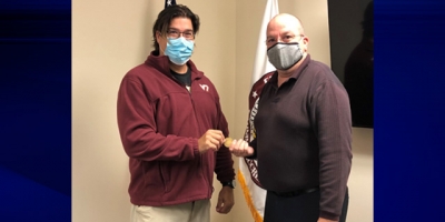 FLETA Executive Director Joe Collins (right) presented Mr. John Lowrey (left) with the FLETA coin FLETA Executive Director Joe Collins(right) presented Mr. John Lowrey (left) with the FLETA coin