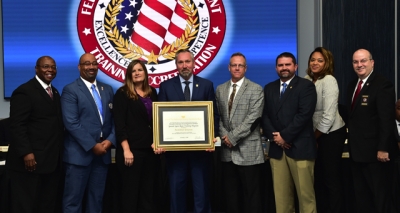 Naval Criminal Investigative Service staff holding the FLETA accreditation certificate Naval Criminal Investigative Service staff holding the FLETA accreditation certificate