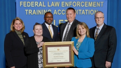 Treasury Inspector General for Tax Administration Academy staff present their reaccreditation certificate Treasury Inspector General for Tax Administration Academy staff present their reaccreditation certificate