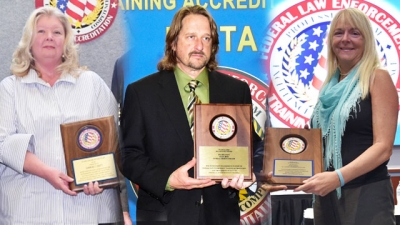 FLETA Team Leaders holding their Recognition Award Plaques FLETA Team Leaders holding their Recognition Award Plaques