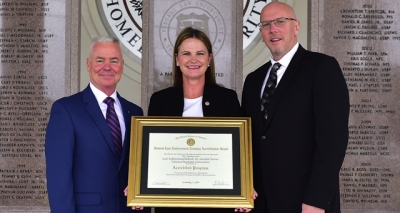 Transportation Security Administration staff holding the FLETA accreditation certificate Transportation Security Administration staff holding the FLETA accreditation certificate