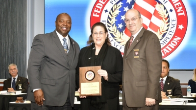 FLETA Board Chair, Dr. James Ward (left) and FLETA Executive Director Joseph Collins (right) present Dr. Molly Wankel the 2018 FLETA Team Leader Recognition Award FLETA Board Chair, Dr. James Ward (left) and FLETA Executive Director Joseph Collins (right) present Dr. Molly Wankel the 2018 FLETA Team Leader Recognition Award