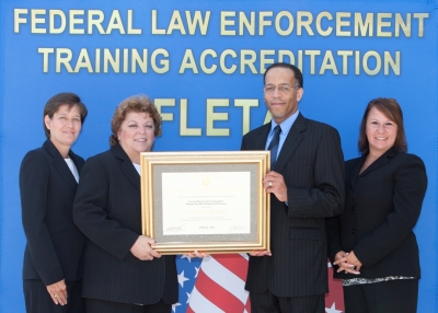 Donna Folmar, Accreditation Manager; Catherine Fletcher, Section Chief; Owen D. Harris, Assistant Director, FBI Training Division; and, Cheree Hammond, Management and Program Analyst