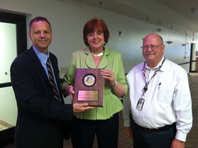 FLETA Board Chairperson, Ronald Ward, Sarah Livingston Team Leader Recipient, and FLETA Executive Director, Dr. Gary Mitchell