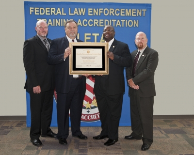 Patrick Ruettiger, Accreditation Manager, LETC; Director Robert D. Cagle, LETC; James Ward, Chief Academic Programs Div., LETC; Trent Pettis, Academic Programs Division Lead, LETC Patrick Ruettiger, Accreditation Manager, LETC; Director Robert D. Cagle, LETC; James Ward, Chief Academic Programs Div., LETC; Trent Pettis, Academic Programs Division Lead, LETC